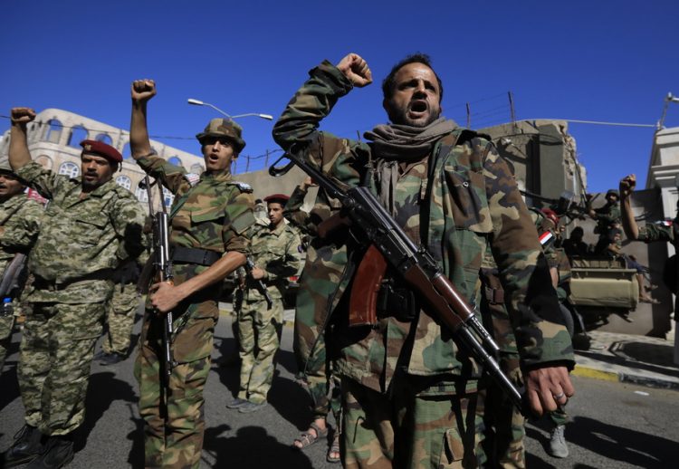 epa10915207 Houthi fighters shout slogans during a military parade in solidarity with Palestinians in the Gaza Strip, in Sana'a, Yemen, 12 October 2023. The top leader of the Houthis movement, Abdul-Malik al-Houthi, has warned that his movement will stand ready to engage in hostilities against Israel should the United States directly back the Israeli military campaign on the Gaza Strip. Thousands of Israelis and Palestinians have died since the militant group Hamas launched an unprecedented attack on Israel from the Gaza Strip on 07 October 2023, leading to Israeli retaliation strikes on the Palestinian enclave.  EPA/YAHYA ARHAB