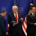 epa12483147 US President Donald Trump (C) looks at a document while standin between Cambodia's Prime Minister Hun Manet (L) and Thailand's Prime Minister Anutin Charnvirakul (R) on the sidelines of the 47th Association of Southeast Asian Nations (ASEAN) Summit in Kuala Lumpur, Malaysia, 26 October 2025.  EPA/MOHD RASFAN / POOL