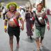 Akjabor Kaiapo, a Brazilian Indigenous activist, left, walks through the venue for the COP30 U.N. Climate Summit, Tuesday, Nov. 11, 2025, in Belem, Brazil. (AP Photo/Andre Penner)