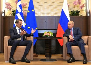 Russian President Vladimir Putin listens to Greek Prime Minister Kyriakos Mitsotakis during a meeting at the Bocharov Ruchei state residence in Sochi, Russia December 8, 2021. Sputnik/Evgeny Odinokov/Kremlin via REUTERS ATTENTION EDITORS - THIS IMAGE WAS PROVIDED BY A THIRD PARTY.