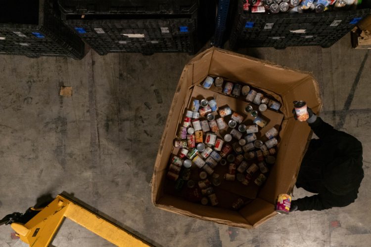Volunteer Matthew Underwool works at MUST Ministries food distribution center, Monday, Nov. 3, 2025, in Marietta, Ga. (AP Photo/Mike Stewart)