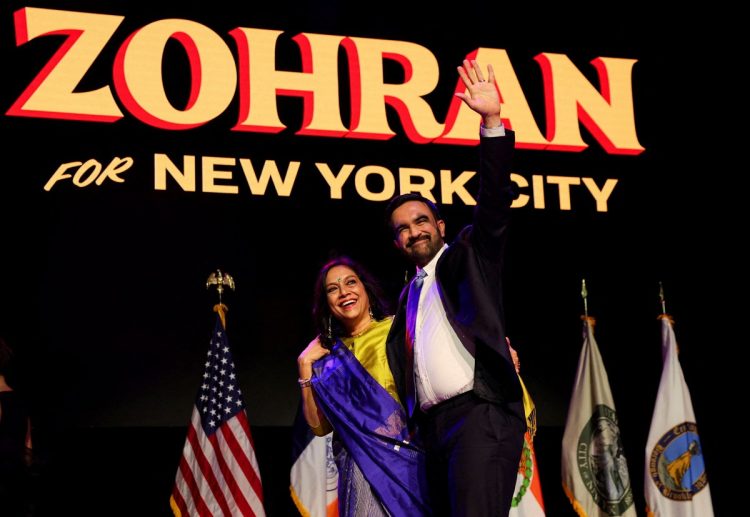 Democratic candidate for New York City mayor Zohran Mamdani waves next to his mother Mira Nair onstage after winning the 2025 New York City Mayoral race, at an election night rally in the Brooklyn borough of New York City, New York, U.S., November 4, 2025.  REUTERS/Shannon Stapleton      TPX IMAGES OF THE DAY