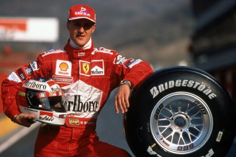 firo: Formula 1, season 1999 Sport, Motorsport, Formula 1, archive, archive pictures Team Ferrari (1996-2006) Michael Schumacher, Germany, was a Formula 1 driver from 1991 to 2006 and 2010 to 2012, Schumacher was 7, seven times , Formula 1, world champion, German national hero, brought Formula 1 after Germany, one of the largest Germans, 1st season at Ferrari Michael Schumacher, car, presentation, with, and his tires, Bridgestone tires, highlight, helmet in hand | usage worldwide (Photo by firo Sportphoto/ / augenklick/firo Sportphoto / dpa Picture-Alliance via AFP)