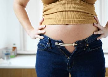 pregnant woman bursting out of jeans. Paul Viant, Digital Vision via Getty Images ** OUTS - ELSENT, FPG, TCN - OUTS * NM, PH, VA if sourced by CT, LA or MoD **