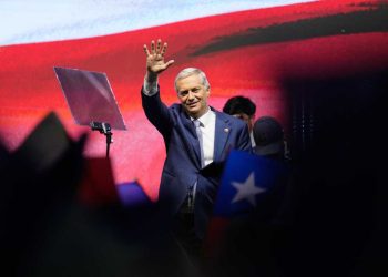 Presidential candidate Jose Antonio Kast, of the opposition Republican Party, waves after winning the presidential runoff election in Santiago, Chile, Sunday, Dec. 14, 2025. (AP Photo/Matias Delacroix)