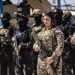 Members of the Syrian Kurdish Asayish security forces stand guard at the Kurdish-run al-Hol camp, which holds relatives of suspected Islamic State (IS) group fighters in the northeastern Hasakeh governorate, on April 18, 2025, as the Syrian Democratic Forces mount a security campaign against IS "sleeper cells" in the camp. Kurdish-run camps and prisons in northeastern Syria still hold about 56,000 people from dozens of countries, many of them the family members of Islamic State group (IS) suspects, more than five years after the jihadists' territorial defeat in Syria. (Photo by Delil SOULEIMAN / AFP) (Photo by DELIL SOULEIMAN/AFP via Getty Images)
