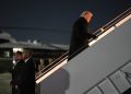President Donald Trump boards Air Force One for a trip to attend the World Economic Form in Davos, Tuesday, Jan. 20, 2026, at Joint Base Andrews, Md. (AP Photo/Evan Vucci)