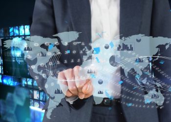 composite of businessman pointing at graphics