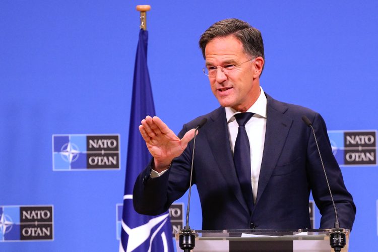 NATO's new Secretary General Mark Rutte gestures as he addresses media during a press conference at NATO headquarters in Brussels on October 1, 2024. - NATO's new chief Mark Rutte on October 1, 2024 downplayed fears over the impact of a potential Donald Trump victory in upcoming US elections and pledged to keep backing Ukraine, as he assumed leadership of the world's most powerful military alliance. (Photo by JOHN THYS / AFP)