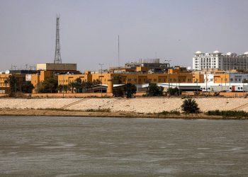 TOPSHOT - The US embassy headquarters in Iraq is pictured in Baghdad's fortified "Green Zone" on March 8, 2026. Air defence systems intercepted rockets fired at the US embassy in Baghdad late on March 7, security sources told AFP. It is the first such attack on the embassy in Baghdad since the start of the war in the Middle East, triggered by a joint US-Israeli attack on Iran, into which Iraq has been dragged. (Photo by AHMAD AL-RUBAYE / AFP via Getty Images)