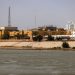 TOPSHOT - The US embassy headquarters in Iraq is pictured in Baghdad's fortified "Green Zone" on March 8, 2026. Air defence systems intercepted rockets fired at the US embassy in Baghdad late on March 7, security sources told AFP. It is the first such attack on the embassy in Baghdad since the start of the war in the Middle East, triggered by a joint US-Israeli attack on Iran, into which Iraq has been dragged. (Photo by AHMAD AL-RUBAYE / AFP via Getty Images)