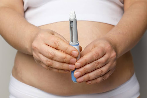 Woman showing opened Semaglutide Injection pen or insulin cartridge pen. Weight loss and diabetes concept.