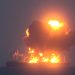 Screen grab taken from a video released on August 21, 2024 by Yemen's Houthis shows what they say is smoke rising from a fire aboard a Greek-flagged oil tanker in the Red Sea. Houthi Military Media/Handout via REUTERS