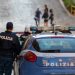Rome, Italy - October 9, 2020: policeman on patrol with Italian police car, in checkpoint in the city.
