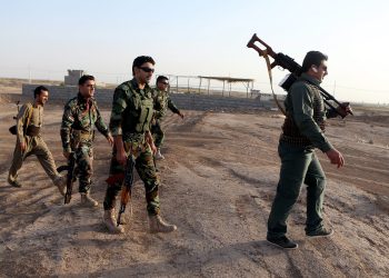 Iraqi Kurdish peshmerga fighters take up positions around the town of Gwer in northern Iraq on Sept. 18. The Kurdish militia is aligned with the U.S. in the battle against the Islamic State.