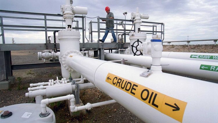 378885 0: Field operator Greg Buckley inspects the pipelines September 21, 2000 at the Federal Strategic Petroleum Reserve facility known as Big Hill near Beaumont, Texas. With America growing concerned over the threat of high heating costs, vice president Al Gore proposed tapping the government's strategic petroleum reserve to force down oil prices before winter arrives. The facility, one of four crude oil storage sites run by the U.S. government is prepared to release oil if the order is issued. The Big Hill facility has 14 underground solution-mined storage caverns that have a combined storage capacity of 160 million barrels. The site has demonstrated the capability to deliver crude at 930,000 barrels per day. The Big Hill site is connected via a 25-mile, 36-inch pipeline to the Sun Marine Terminal and the Unocal Marine Terminal at Nederland, Texas. The pipeline also interconnects with the Texaco 20-inch pipeline system in Port Arthur, Texas. The reserve, created in 1975 after the Arab oil embargo, is intended to provide a stopgap in case of disruptions in oil imports. It has been used only once, during the Gulf War in 1991. (Photo by Joe Raedle/Newsmakers)