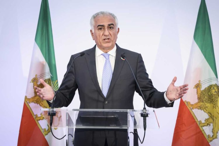 Reza Pahlavi, the son of Iran's toppled Shah Mohammad Reza Pahlavi, speaks during a press conference, Monday, June 23, 2025 in Paris. (AP Photo/Thomas Padilla)