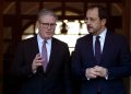 Cyprus' President Nikos Christodoulides, right, and Britain's Prime Minister Keir Starmer talk outside the presidential palace after their meeting, in capital Nicosia, Cyprus, Tuesday, Dec. 10, 2024. (AP Photo/Petros Karadjias)