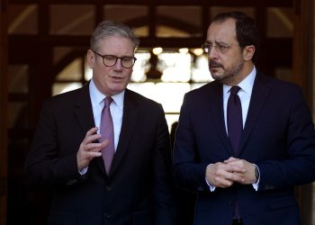Cyprus' President Nikos Christodoulides, right, and Britain's Prime Minister Keir Starmer talk outside the presidential palace after their meeting, in capital Nicosia, Cyprus, Tuesday, Dec. 10, 2024. (AP Photo/Petros Karadjias)