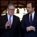 Cyprus' President Nikos Christodoulides, right, and Britain's Prime Minister Keir Starmer talk outside the presidential palace after their meeting, in capital Nicosia, Cyprus, Tuesday, Dec. 10, 2024. (AP Photo/Petros Karadjias)